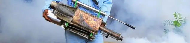 Fumigation technician using a fogger for deep pest treatment in Marietta, GA
